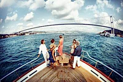 5 friends having a bosphorus cruise tour at Bosphorus sea of Istanbul